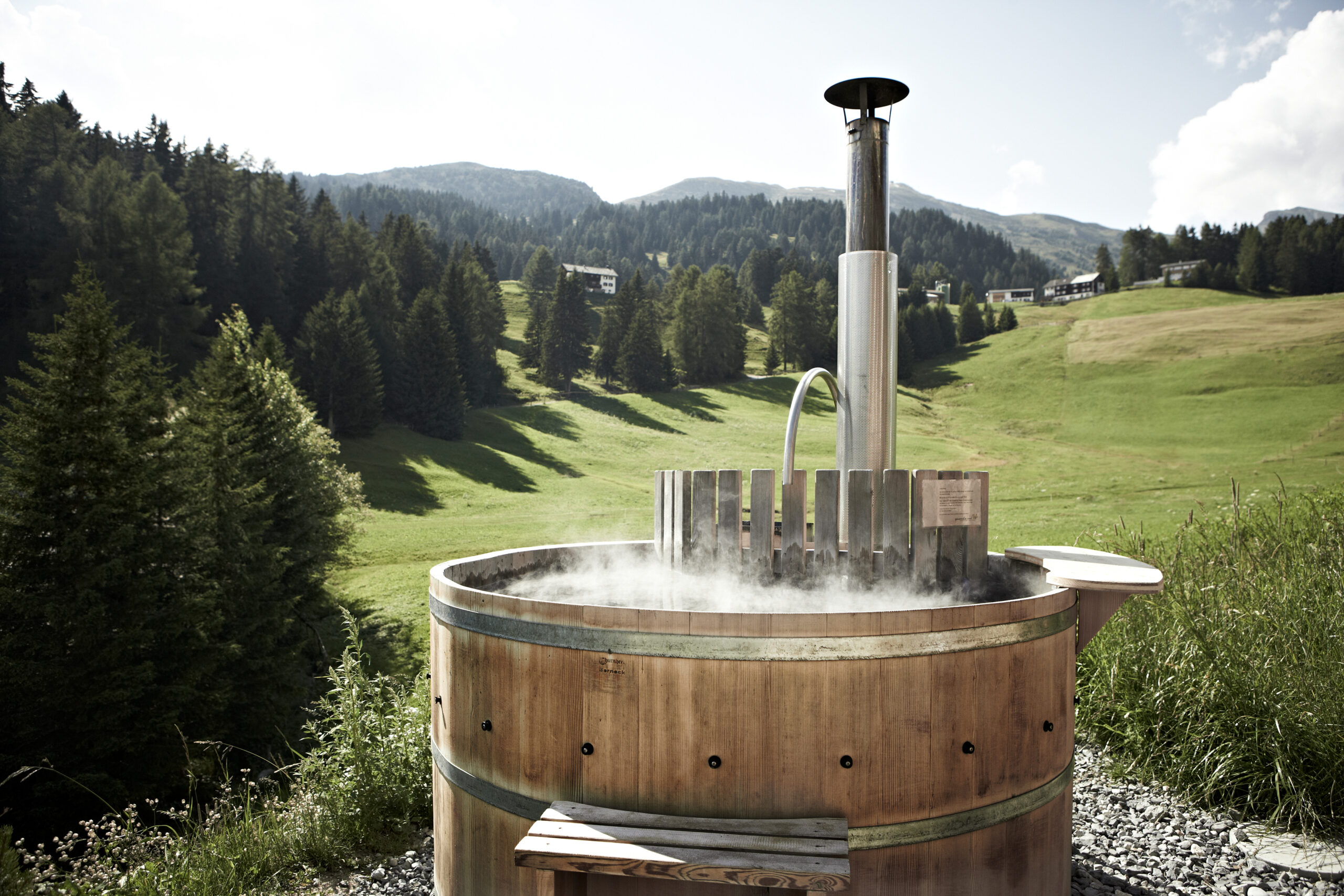 rustic hot pot with great views of the Swiss Alps at one of the best alpine chic hotels in Switzerland