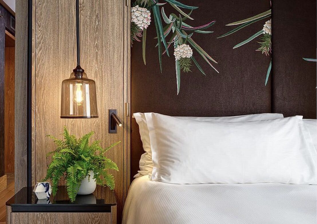 Bedroom inside the Vegan Suite at Hilton London Bankside using pineapple leather